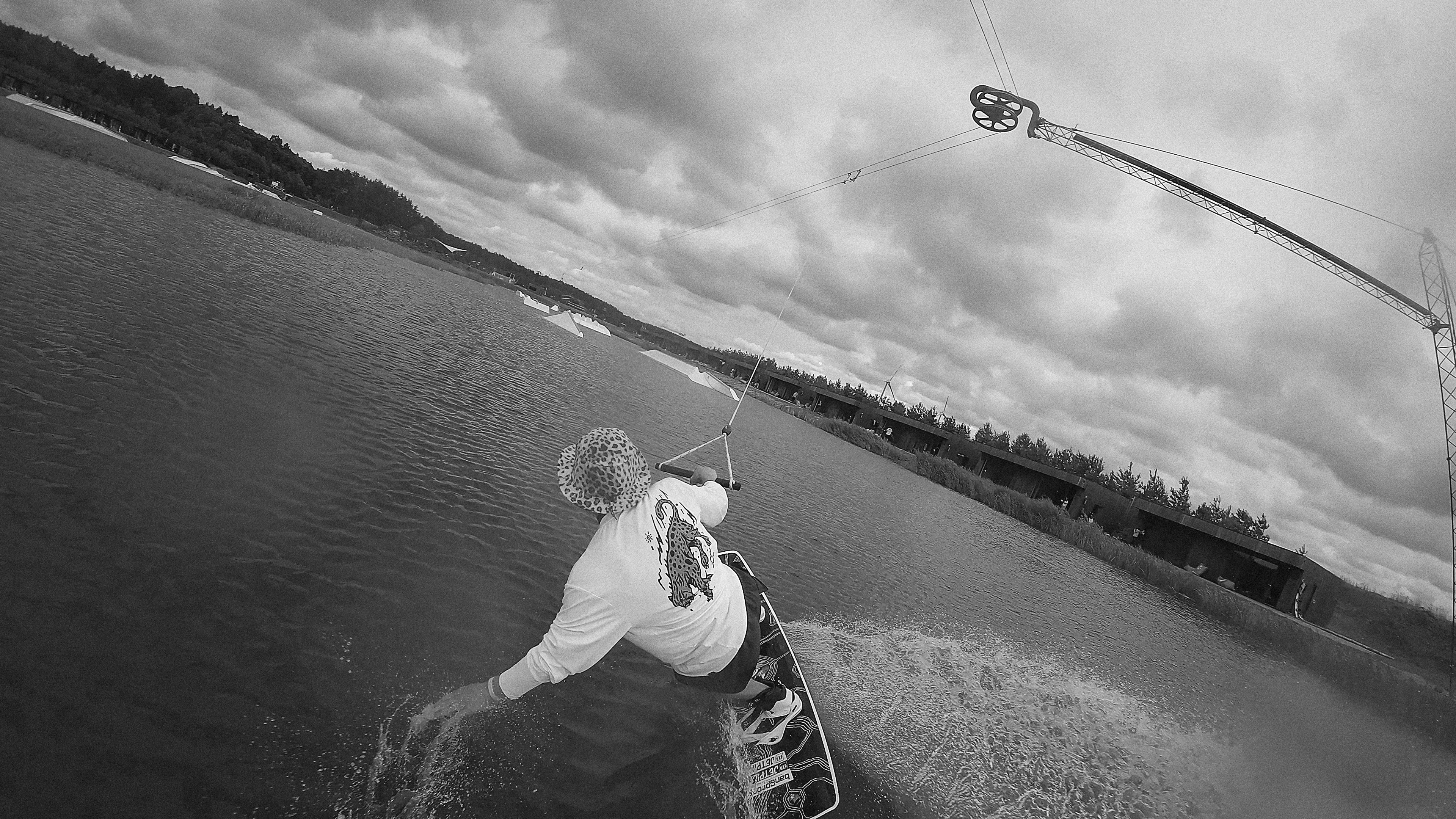 Wet, moving, overcast. The rider off to one side of the frame.